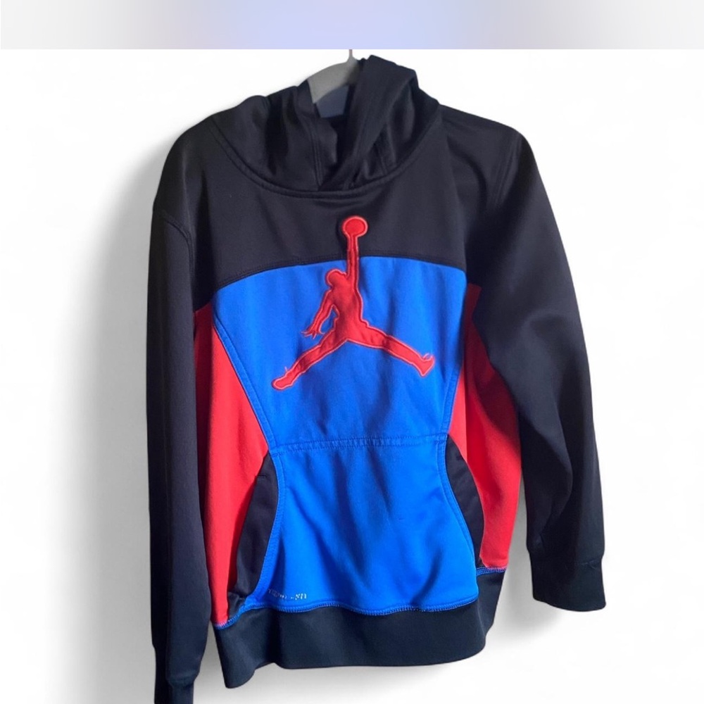 Nike Jordan Therma-FIT pullover hoodie in black, red, and blue.